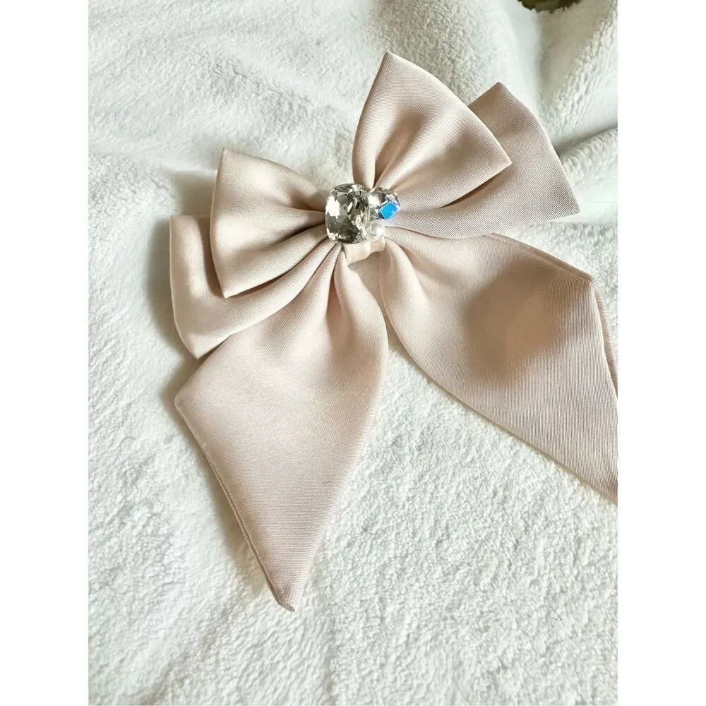Light pink hair bow clip with super sparkly rhinestone and embellishment ￼